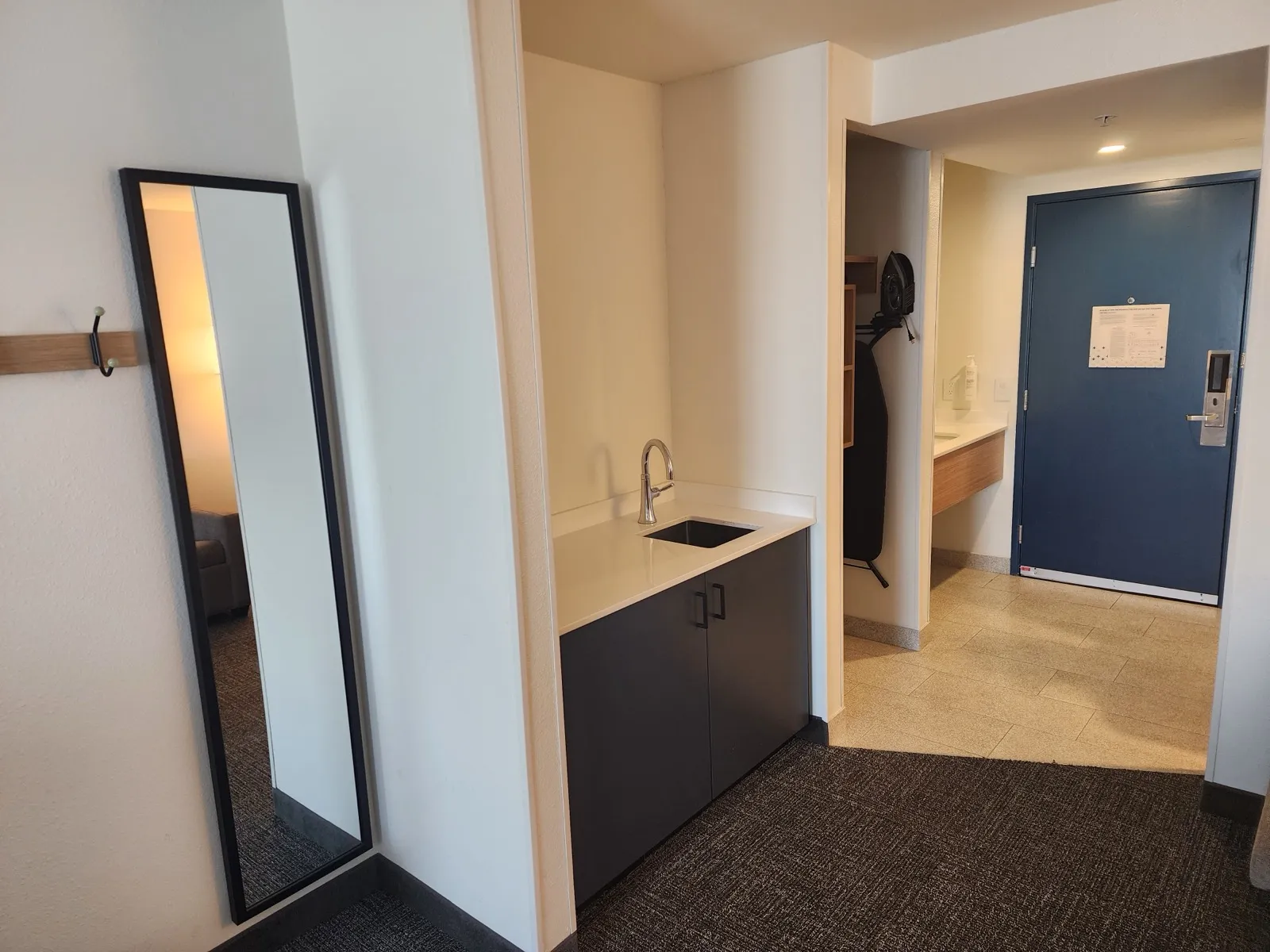 Spark by Hilton guest room entry and wet bar area